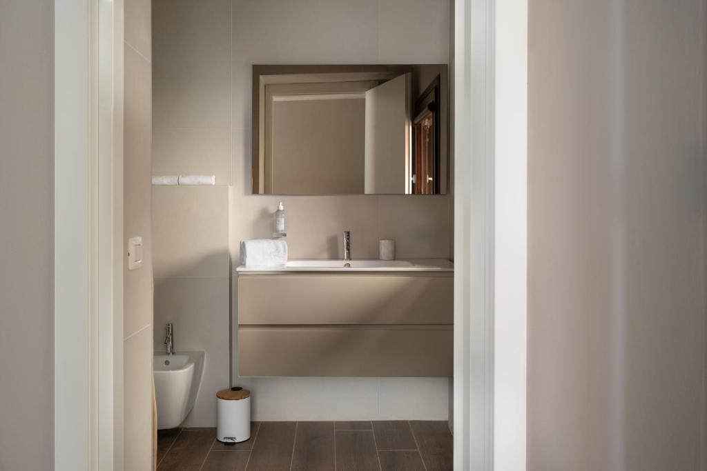 a bathroom with a sink and a toilet at Villa Il Platano in Como
