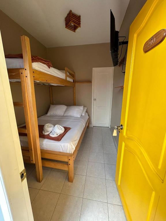 Postel nebo postele na pokoji v ubytování Chescos Hotel