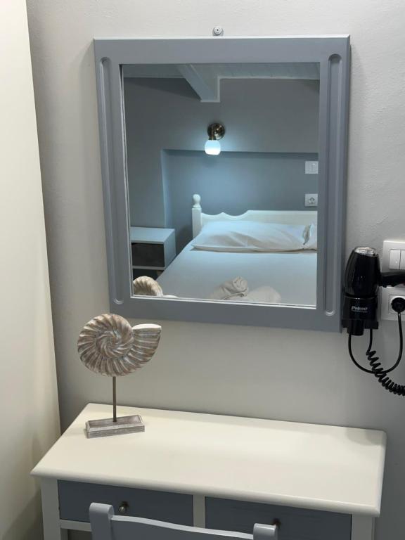 A bed or beds in a room at Venus Rooms