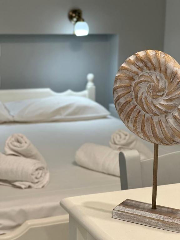 A bed or beds in a room at Venus Rooms