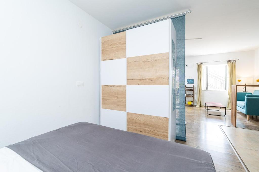 Posteľ alebo postele v izbe v ubytovaní Apartments Marivo Lapad
