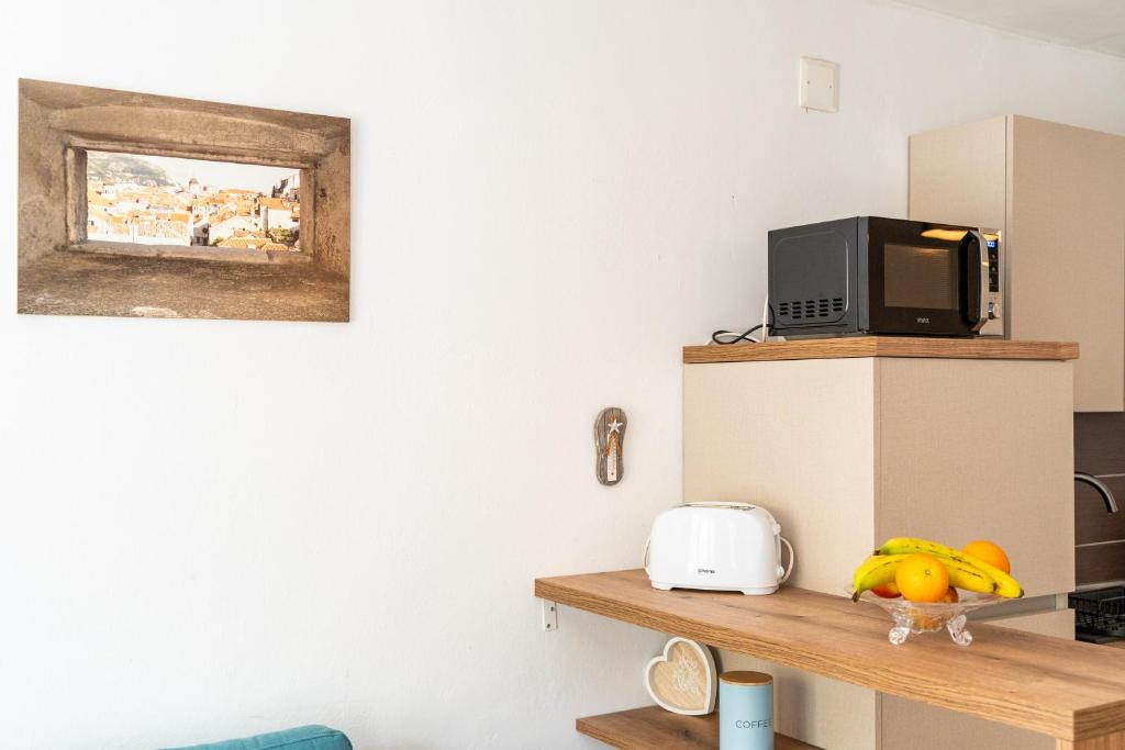 Kuchyňa alebo kuchynka v ubytovaní Apartments Marivo Lapad