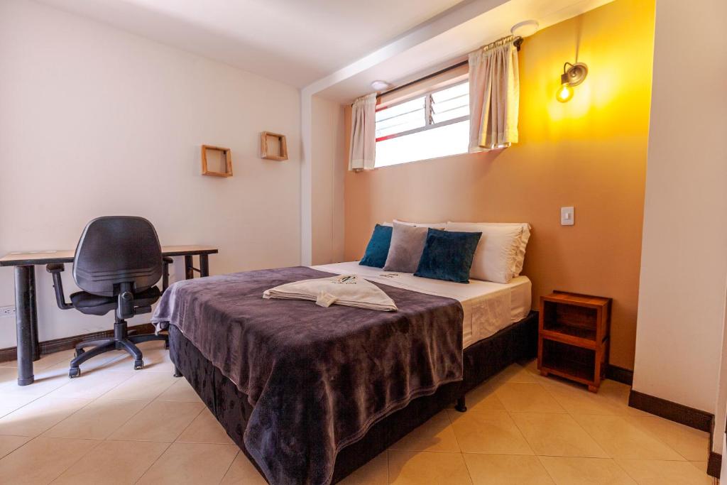 Postel nebo postele na pokoji v ubytování Poblado Guest House
