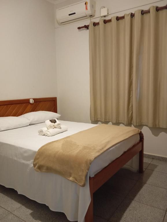 Postel nebo postele na pokoji v ubytování Mariachis Hotel