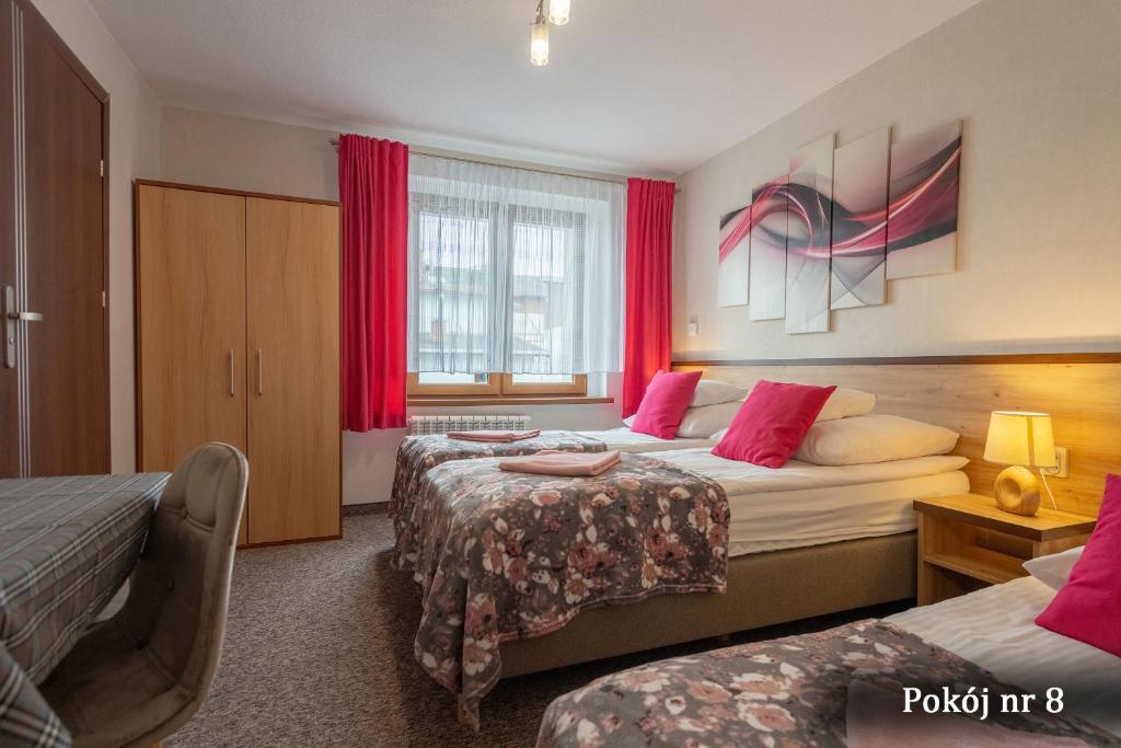 Postel nebo postele na pokoji v ubytování Willa Puchatek