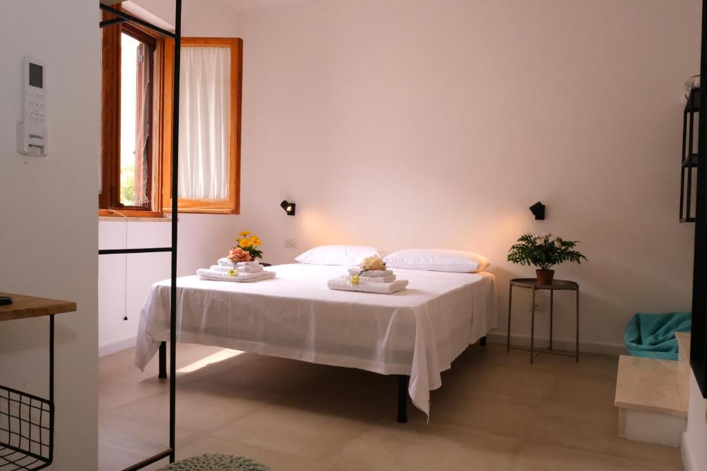 Postel nebo postele na pokoji v ubytování Sunset Beach House Buggerru