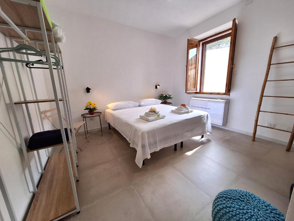 Postel nebo postele na pokoji v ubytování Sunset Beach House Buggerru