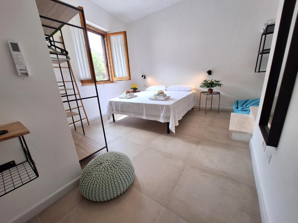 Postel nebo postele na pokoji v ubytování Sunset Beach House Buggerru