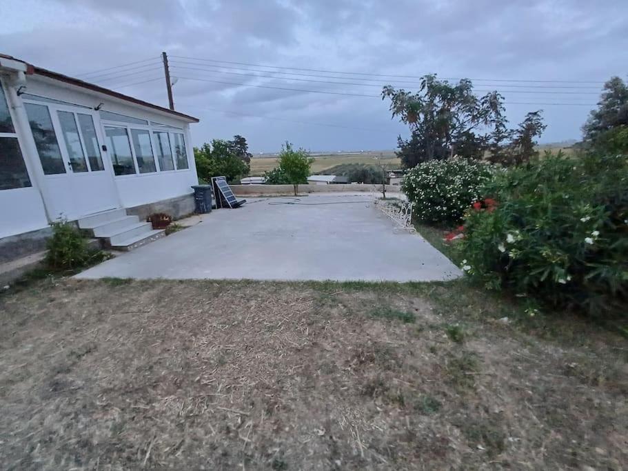 a house with a parking lot in front of it at 3 Bedroom Bangalow in Iskele