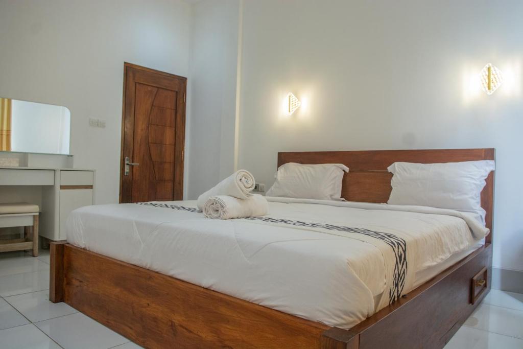Postel nebo postele na pokoji v ubytování Turtle House Lombok