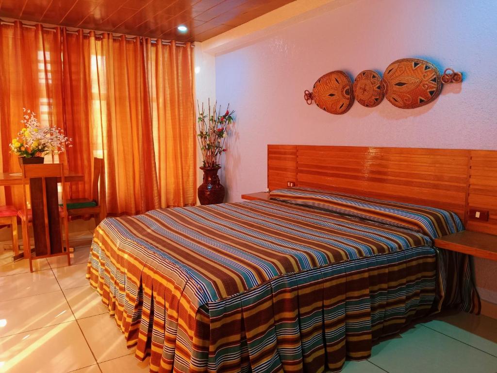 Postel nebo postele na pokoji v ubytování CITI HOTEL