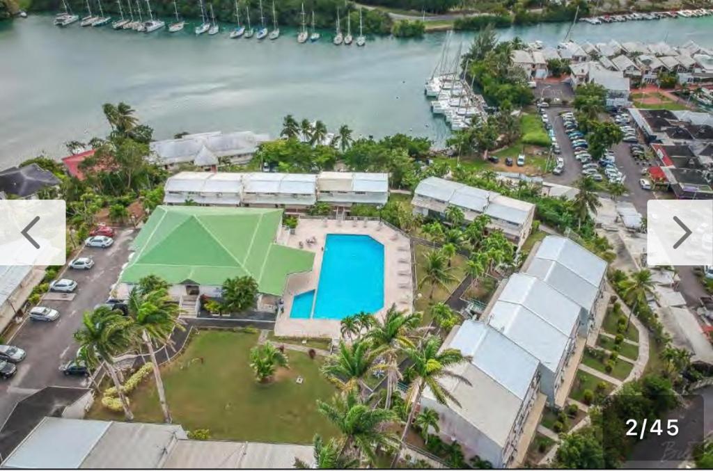 an aerial view of a house with a pool at Duplex piscine vue imprenable Marina du Gosier avec citerne in Le Gosier