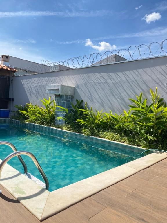 Bazén v ubytování Aconchego! Sua casa com Piscina em Passos!! nebo v jeho okolí