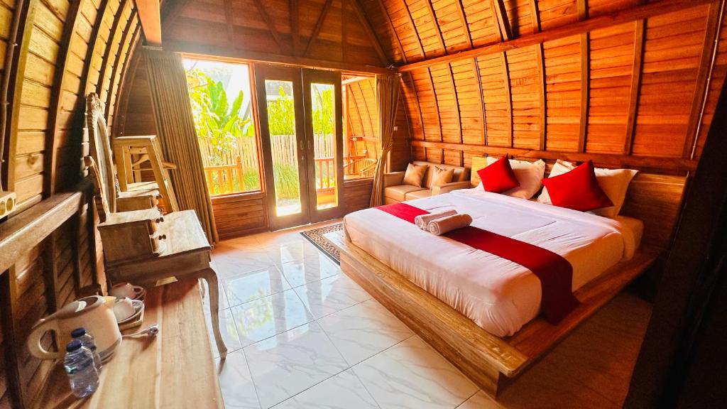 a bedroom with a bed in a wooden room at Volcano Valley in Kintamani