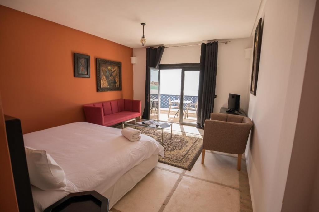 Postel nebo postele na pokoji v ubytování Hôtel Calipau Riad Maison d'Hôtes