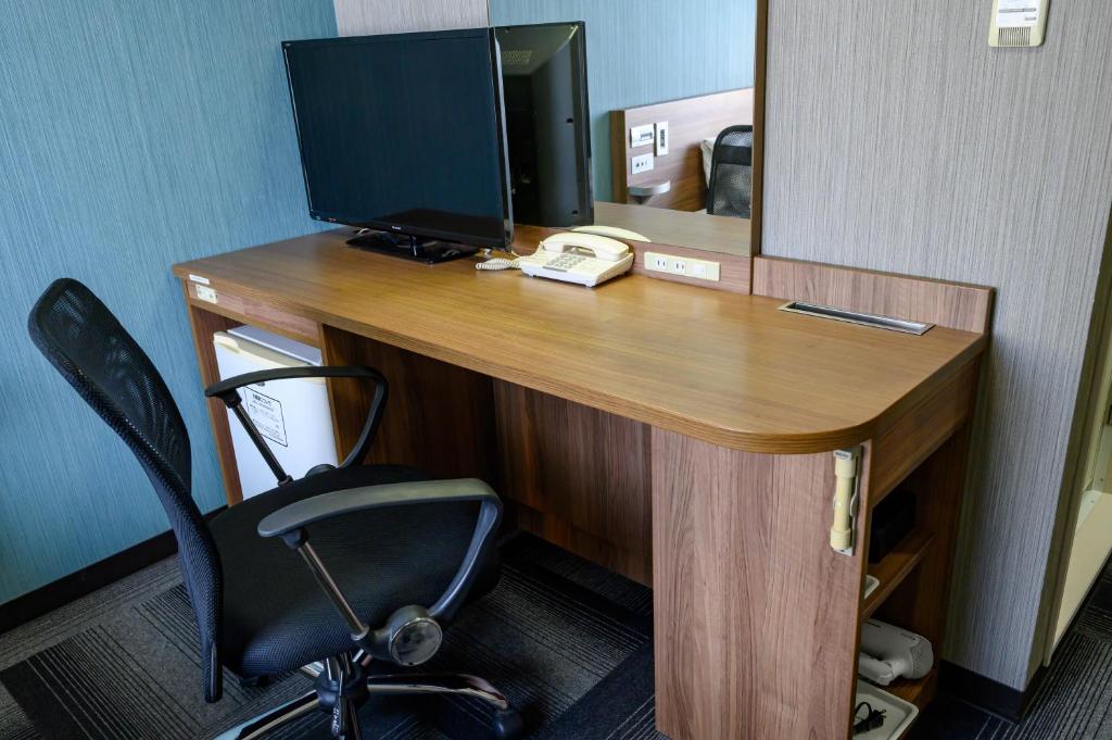 TV a/nebo společenská místnost v ubytování Hotel Econo Kameyama