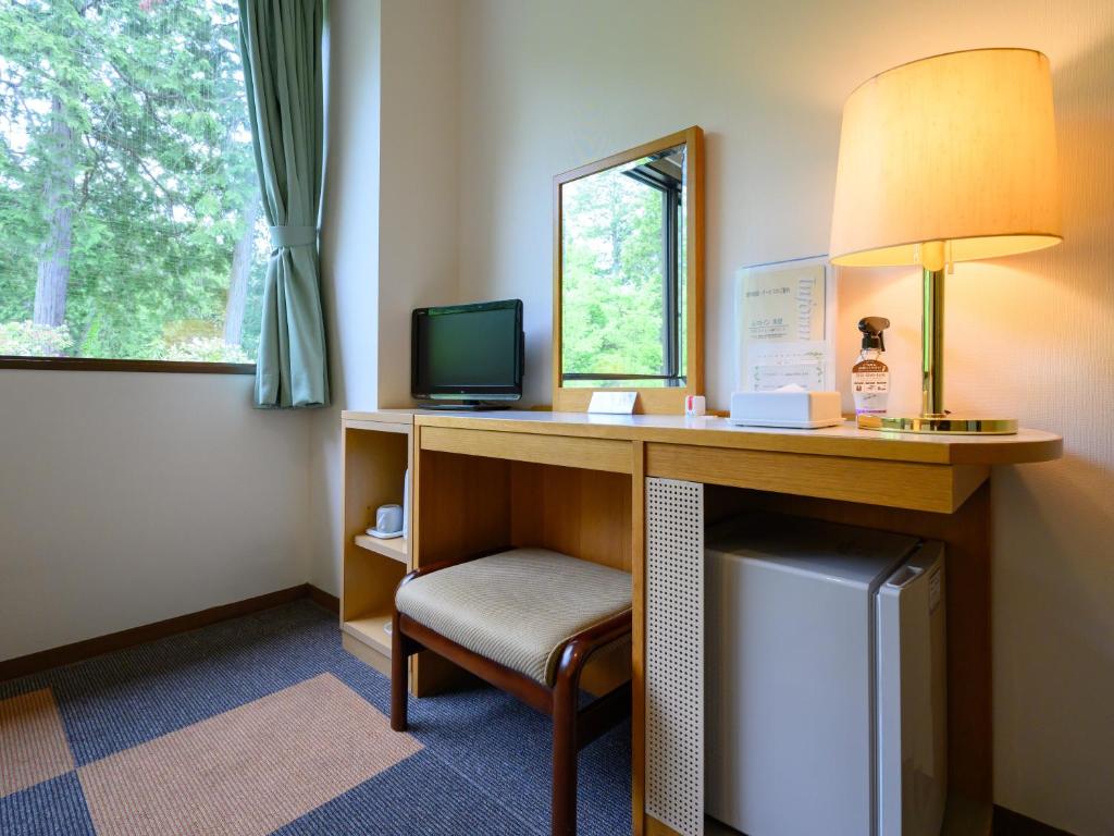 TV a/nebo společenská místnost v ubytování Rest Inn Taga