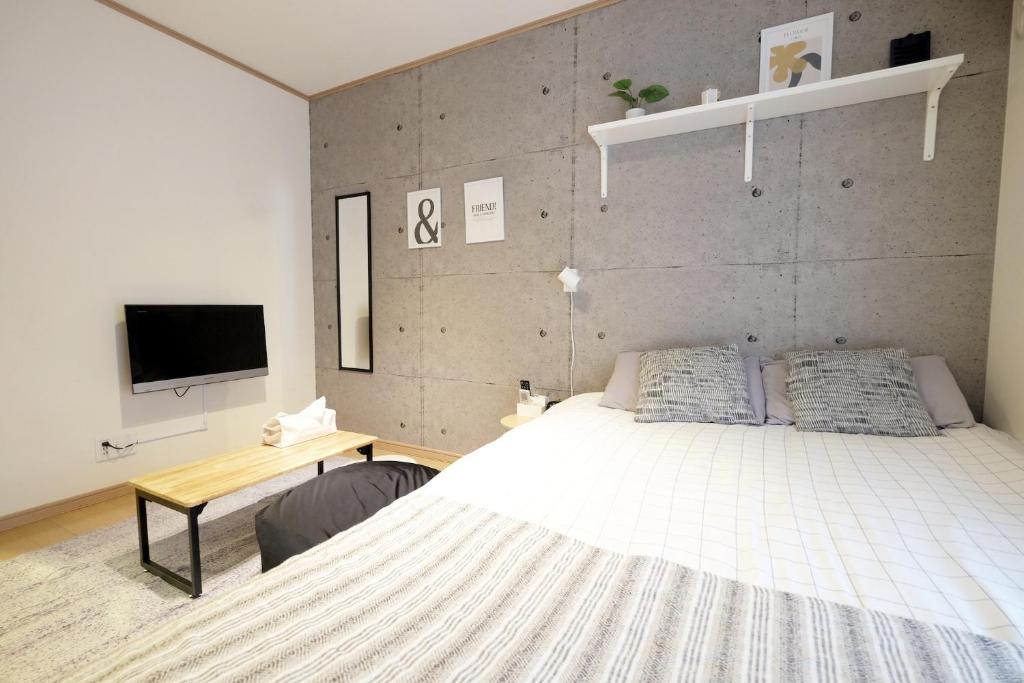 Ένα ή περισσότερα κρεβάτια σε δωμάτιο στο Daiichi Mitsumi Corporation - Vacation STAY 15270