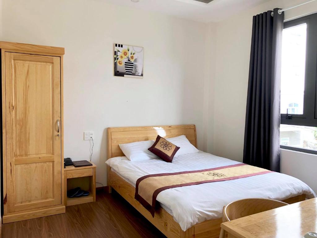 Postel nebo postele na pokoji v ubytování S79 Hoa Dang Hotel