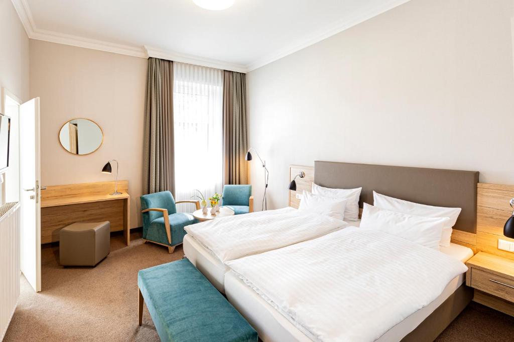 Postel nebo postele na pokoji v ubytování Hotel Noltmann-Peters