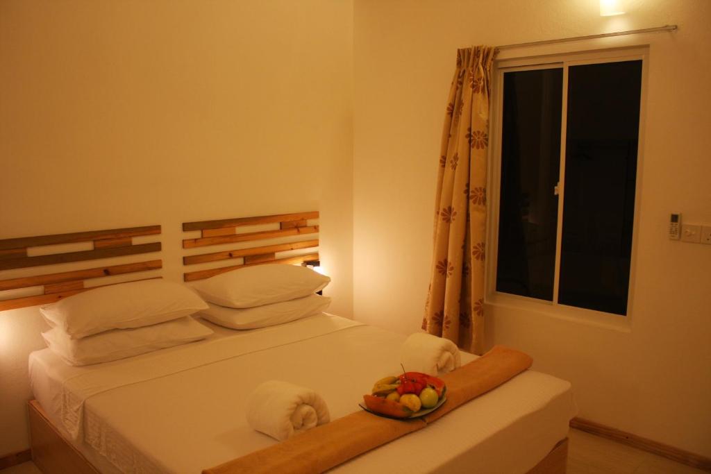 Postel nebo postele na pokoji v ubytování Relax Residence Thoddoo Maldives