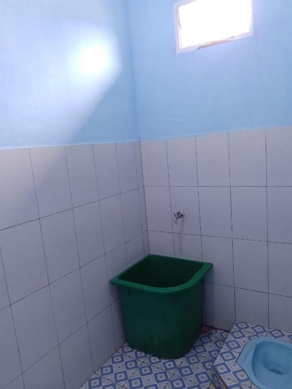 Koupelna v ubytování Simbolon Homestay Samosir