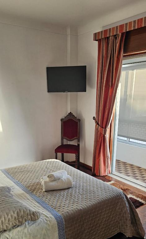 Postel nebo postele na pokoji v ubytování Casa da Praia