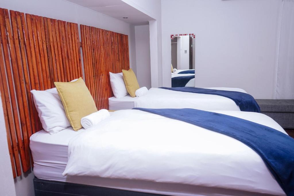 Postel nebo postele na pokoji v ubytování Safi Suites and Conference Centre