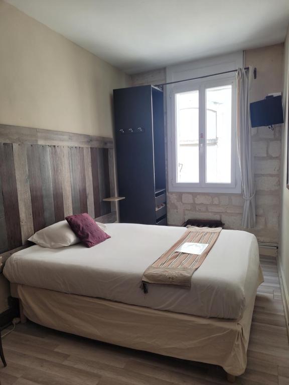 Postel nebo postele na pokoji v ubytování Hotel Boquier