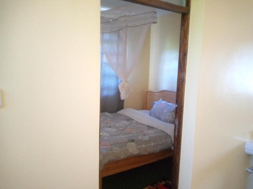 Postel nebo postele na pokoji v ubytování Esam Homestay