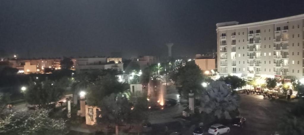a city at night with a large building at KRISHNA 1 BHK Palace Omaxe in Vrindāvan