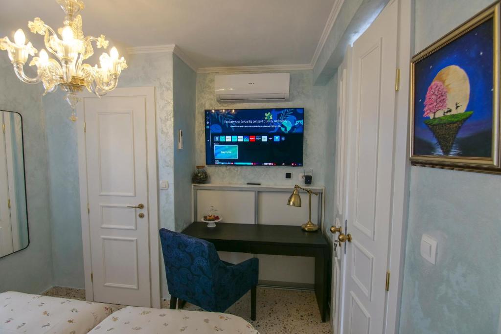 Телевизор и/или развлекательный центр в Villa Arba