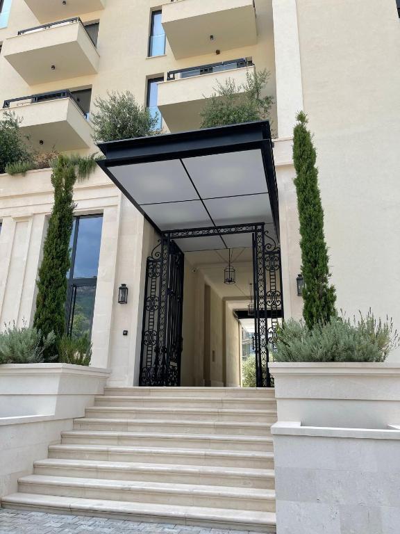 an entrance to a building with stairs and plants at CASA AL MARE RESIDENCE in Bečići