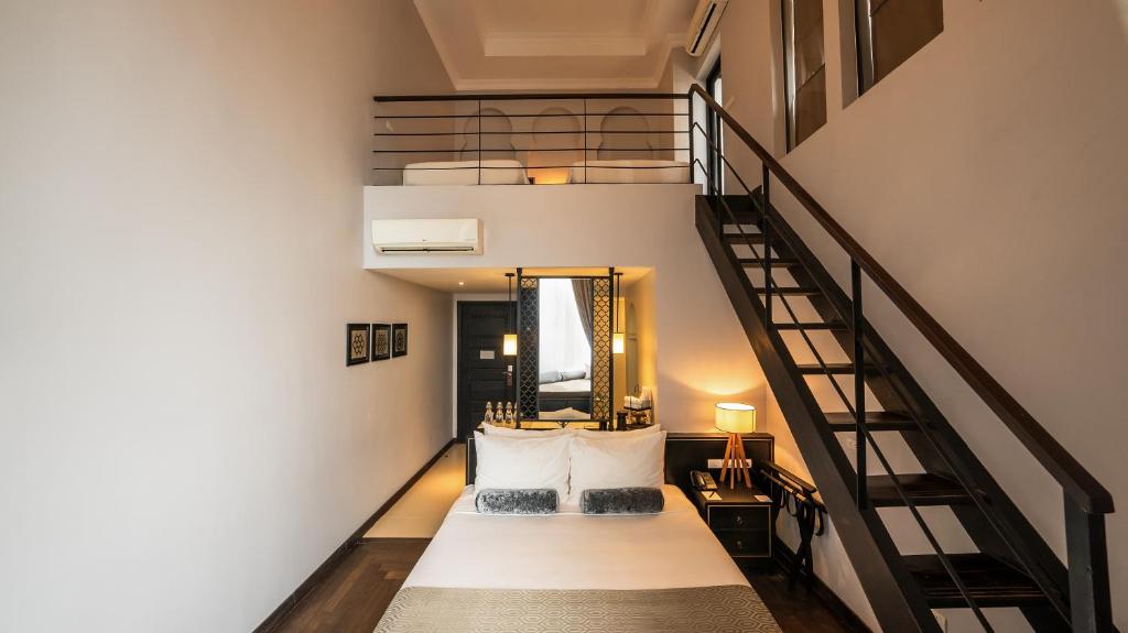 Postel nebo postele na pokoji v ubytování Sarai and Wander Hotel