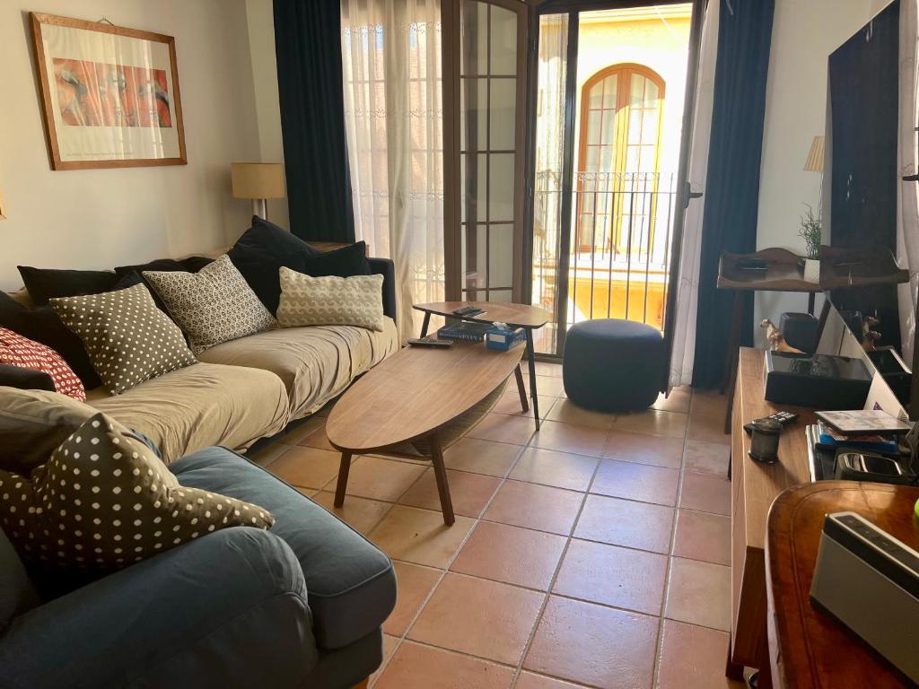 a living room with a couch and a table at Luxury penthouse Apartment in Cuevas del Almanzora