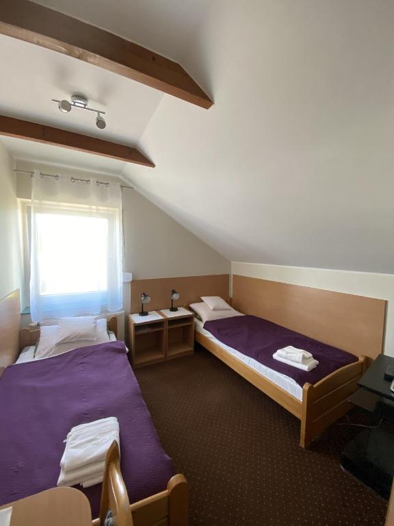 Posteľ alebo postele v izbe v ubytovaní Motel Orion
