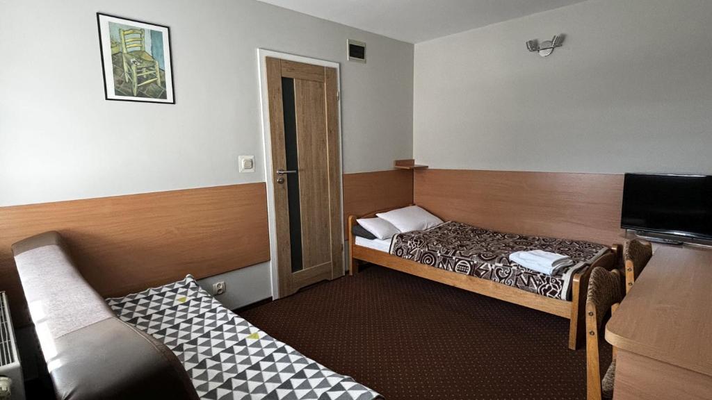 Posteľ alebo postele v izbe v ubytovaní Motel Orion