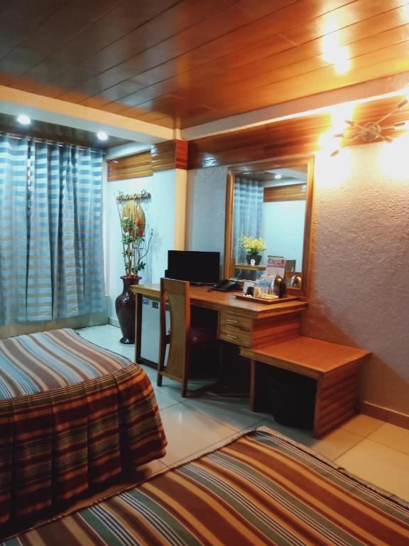 Postel nebo postele na pokoji v ubytování CITI HOTEL