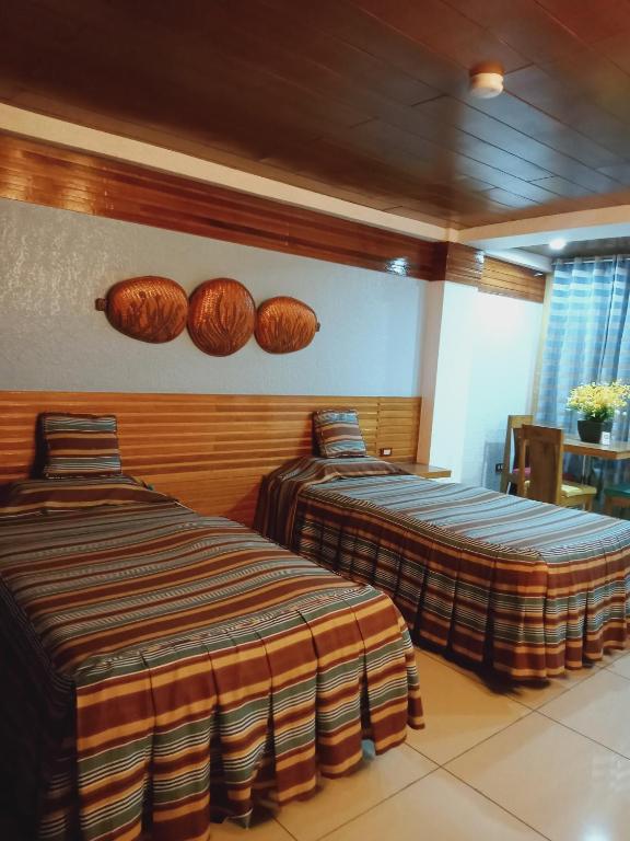 Postel nebo postele na pokoji v ubytování CITI HOTEL