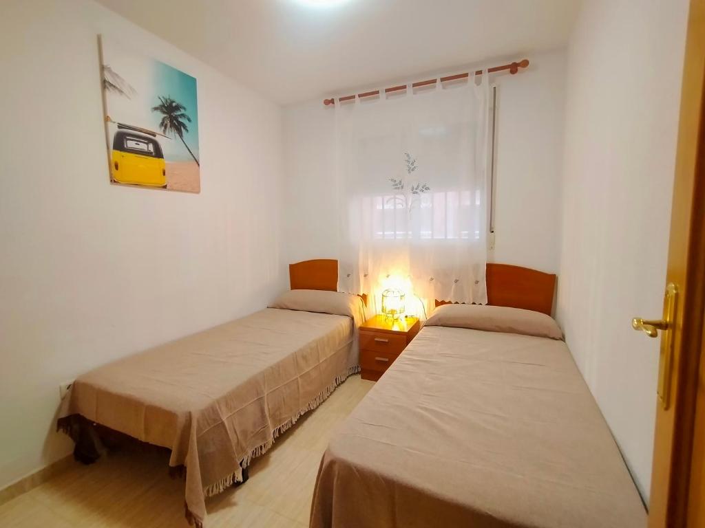 A bed or beds in a room at ACV - Costa Marina I-1ª linea planta 2 sur