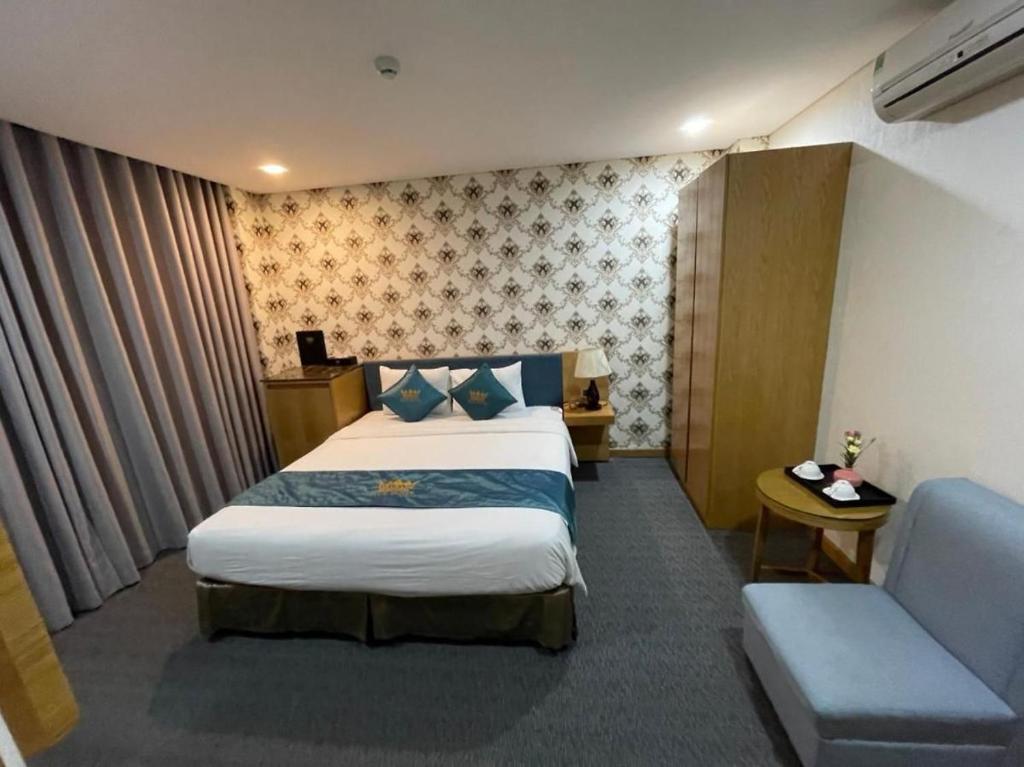 Cama ou camas em um quarto em Blue Hotel