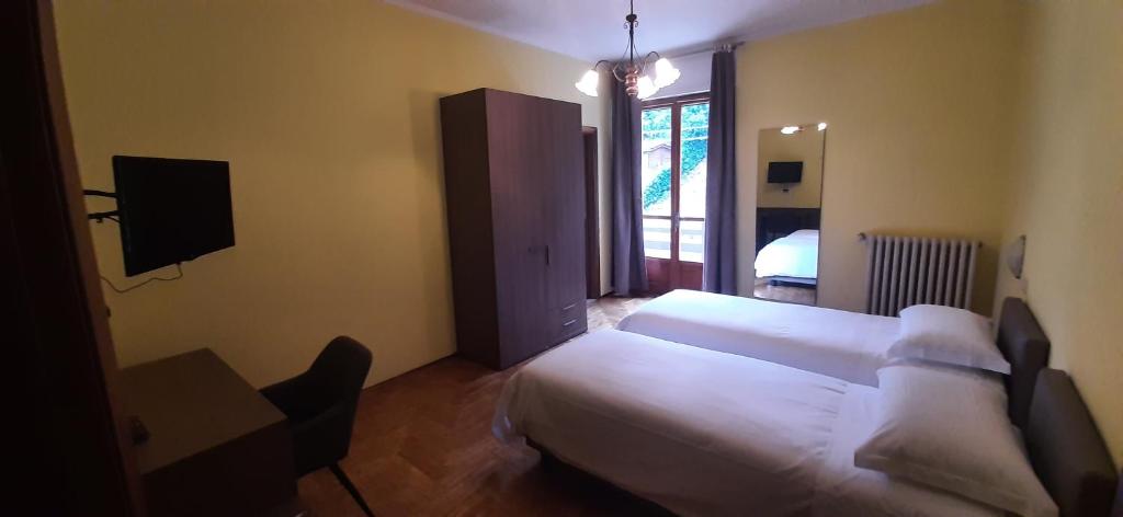 Postel nebo postele na pokoji v ubytování Albergo LA COLDRA