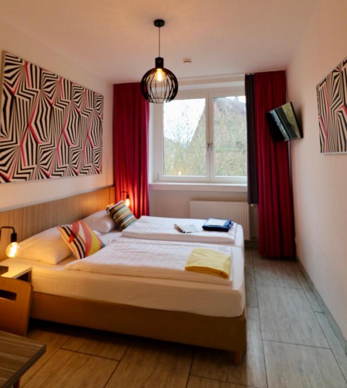 Postel nebo postele na pokoji v ubytování Hotel Madeleine Biohotel