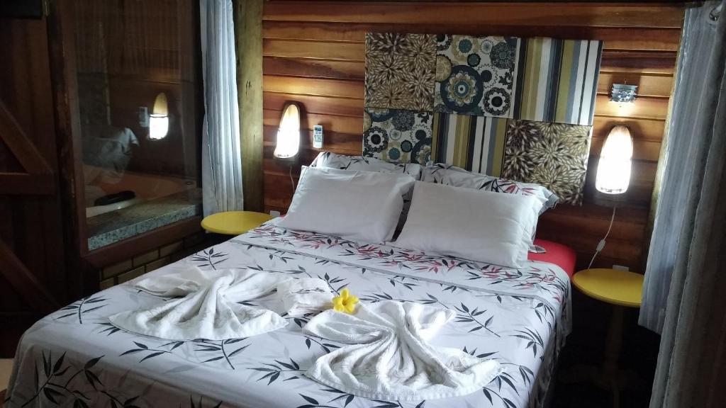 Cama ou camas em um quarto em Pousada Favo De Mel