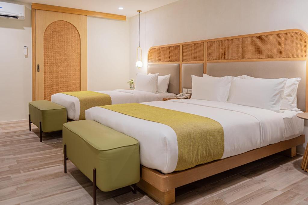 Postel nebo postele na pokoji v ubytování Mandarin Nest Boracay
