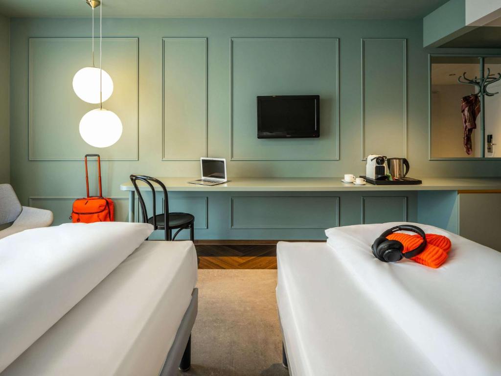 Uma cama ou camas num quarto em ibis Styles Graz Messe