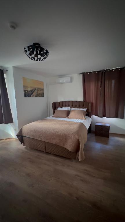 Postel nebo postele na pokoji v ubytování Hôtel Séjour D'Ardenne