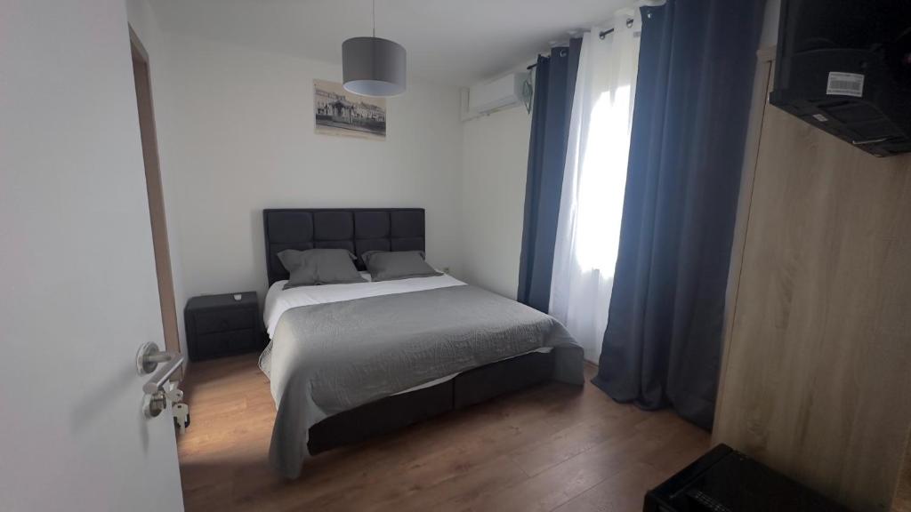 Postel nebo postele na pokoji v ubytování Hôtel Séjour D'Ardenne