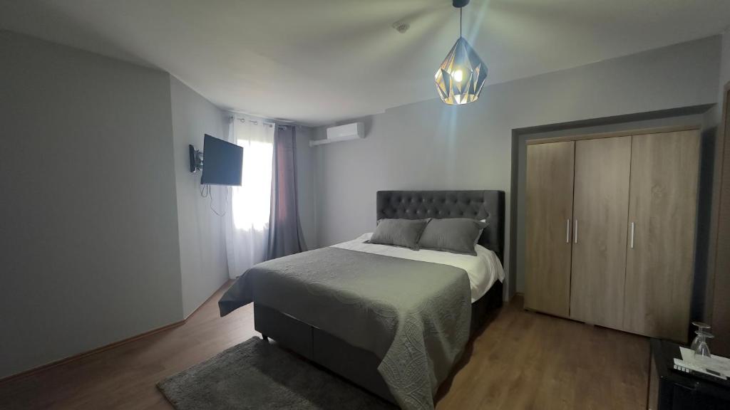 Postel nebo postele na pokoji v ubytování Hôtel Séjour D'Ardenne
