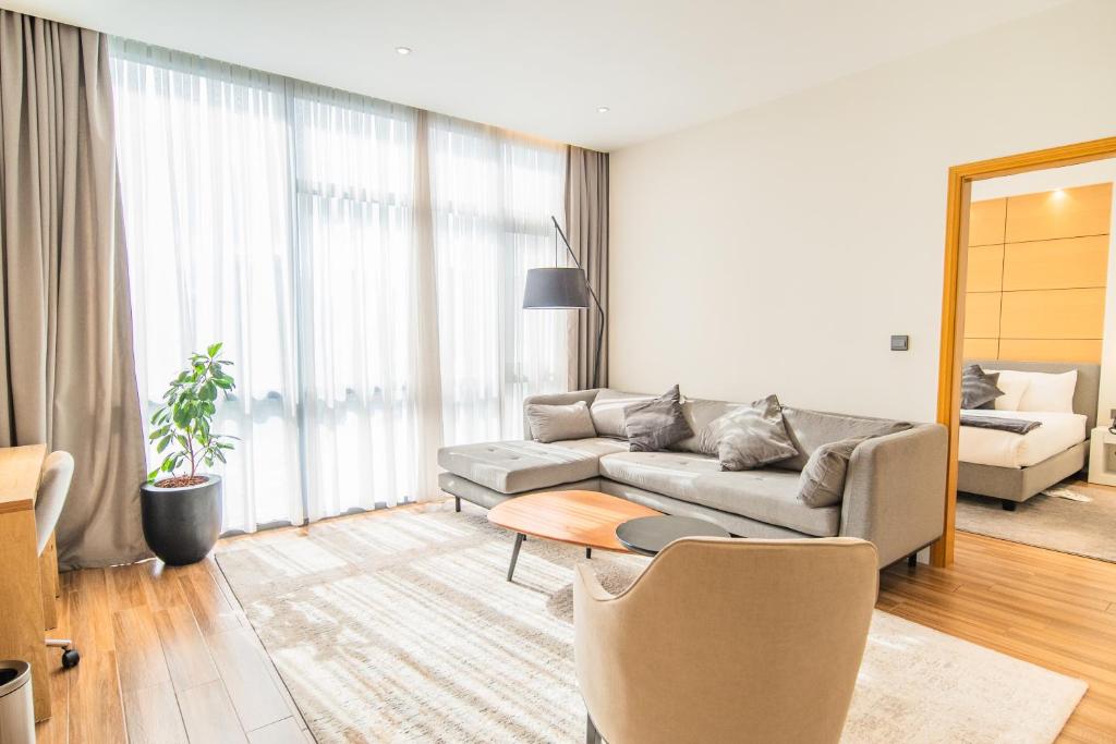 a living room with a couch and a table at Loft Hotel Apartment in Addis Ababa